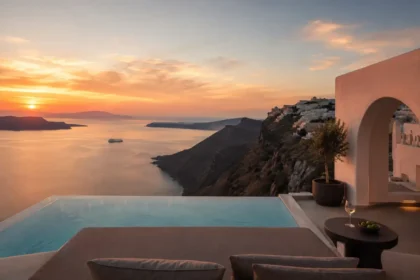 Private Santorini hotel terrace with panoramic sunset views across the caldera