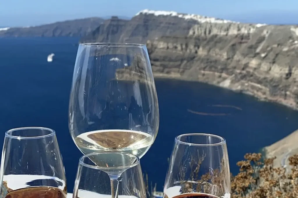 Wine glasses arranged for a tasting at Venetsanos Winery in Santorini.