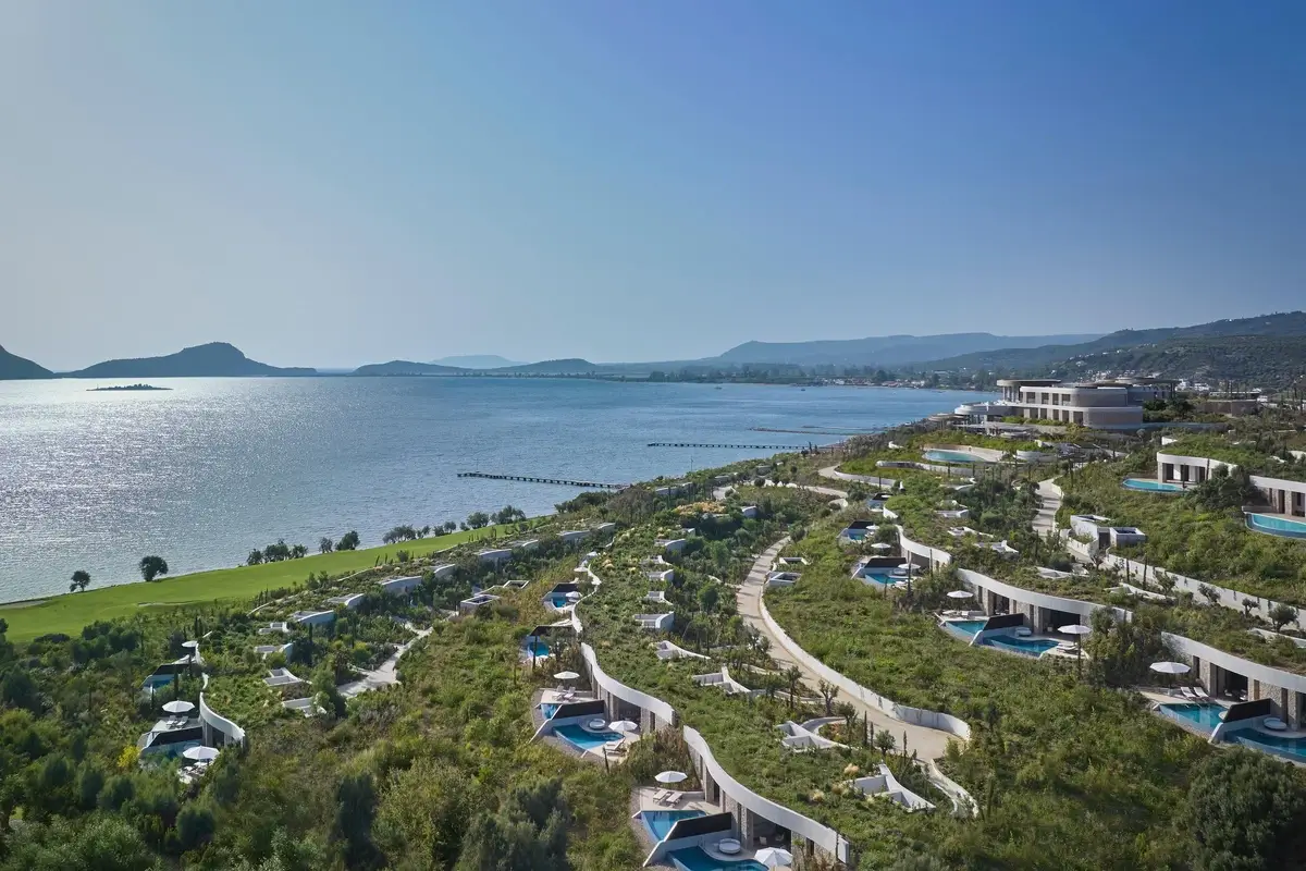 Aerial view of Mandarin Oriental, Costa Navarino, with landscaped hillside villas above Navarino Bay.