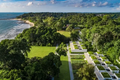 Aerial view of low-rise suites amid trees and lawns beside the South China Sea at Mandarin Oriental, Desaru Coast.