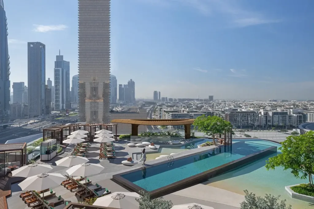 Elevated pool terrace with loungers, umbrellas, and Dubai’s towers beyond at Mandarin Oriental Downtown.