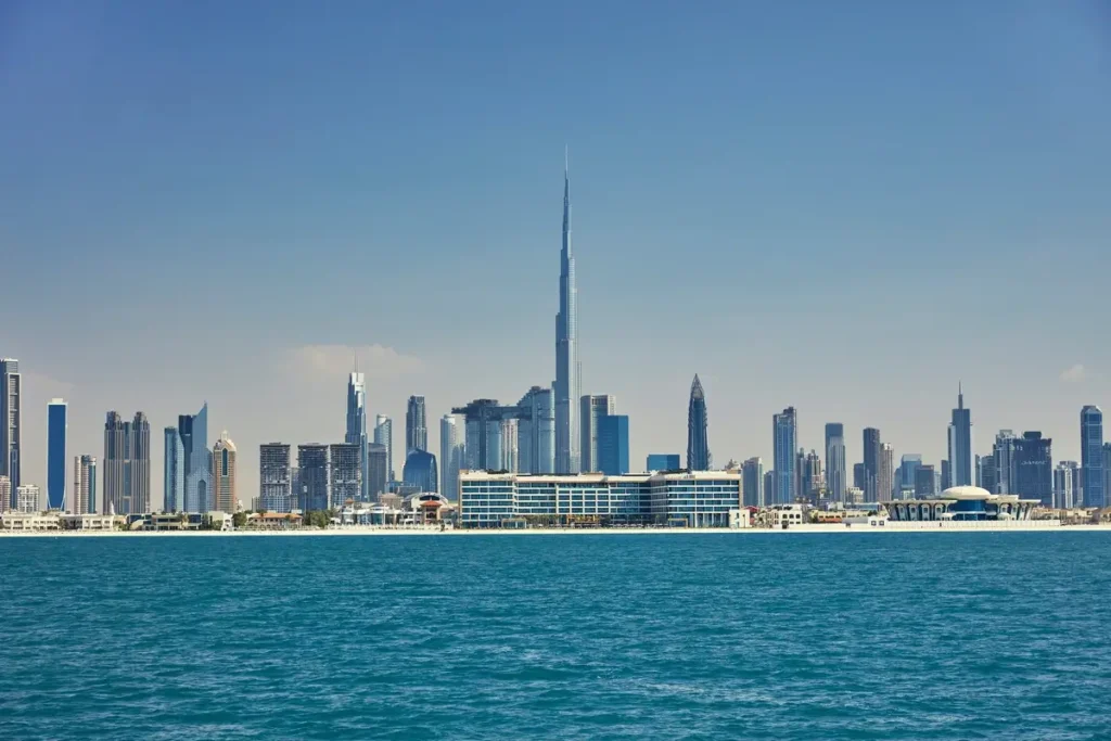View from the water toward Mandarin Oriental Jumeira and Dubai’s skyline, including Burj Khalifa.